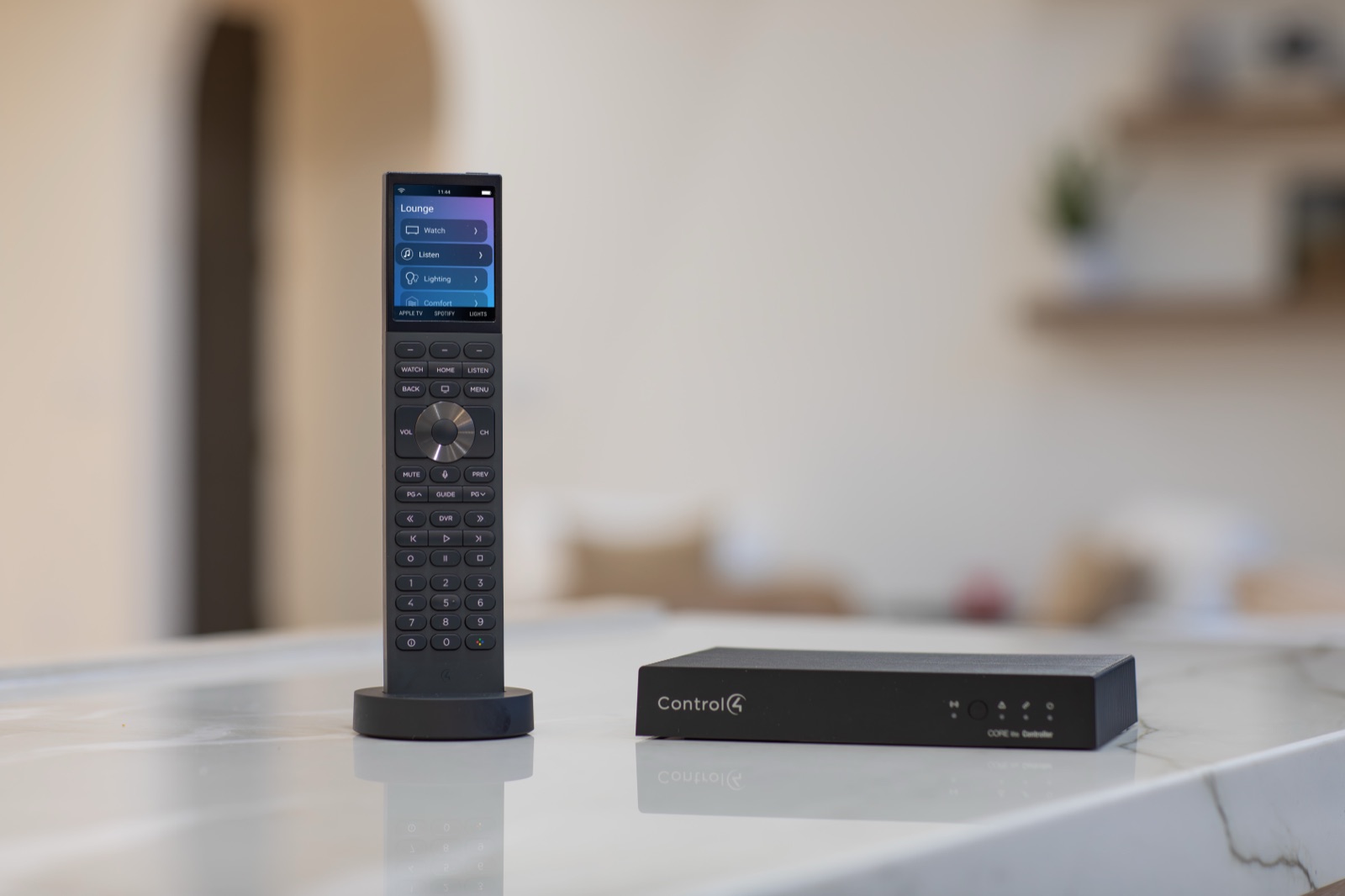 A Control4 Halo remote on its charging dock