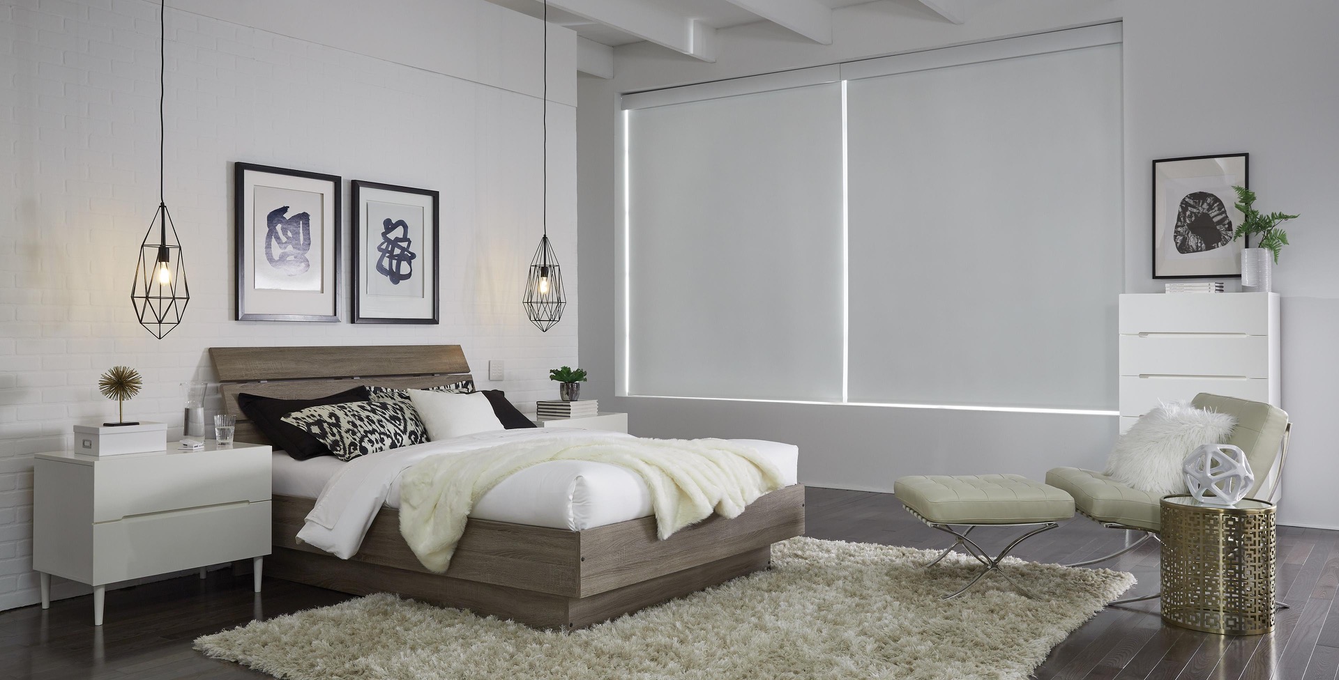 Two white Triathlon roller shades lowered across a bedroom window