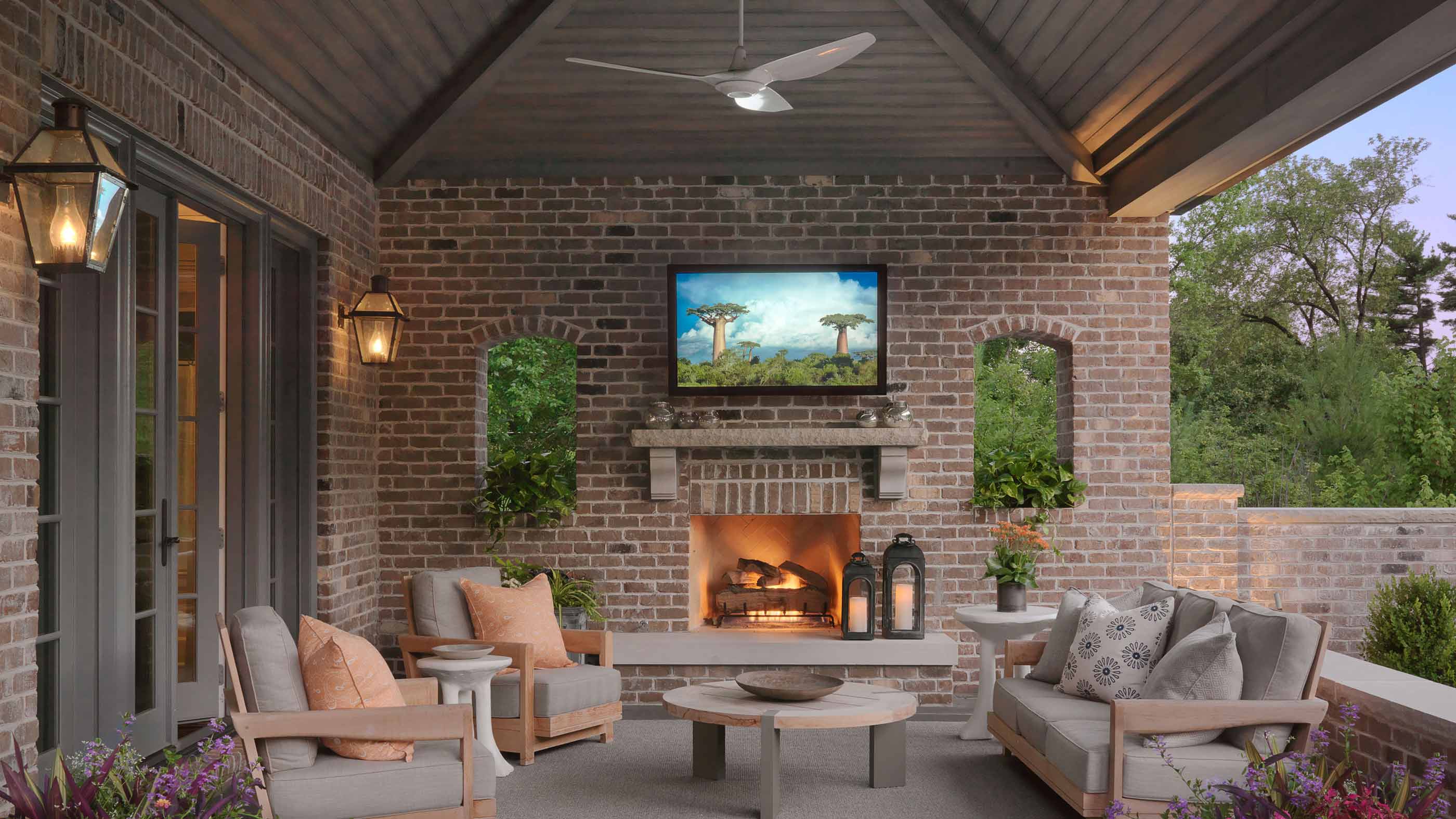 Covered patio with a pergola, a weatherproof TV, and outdoor seating