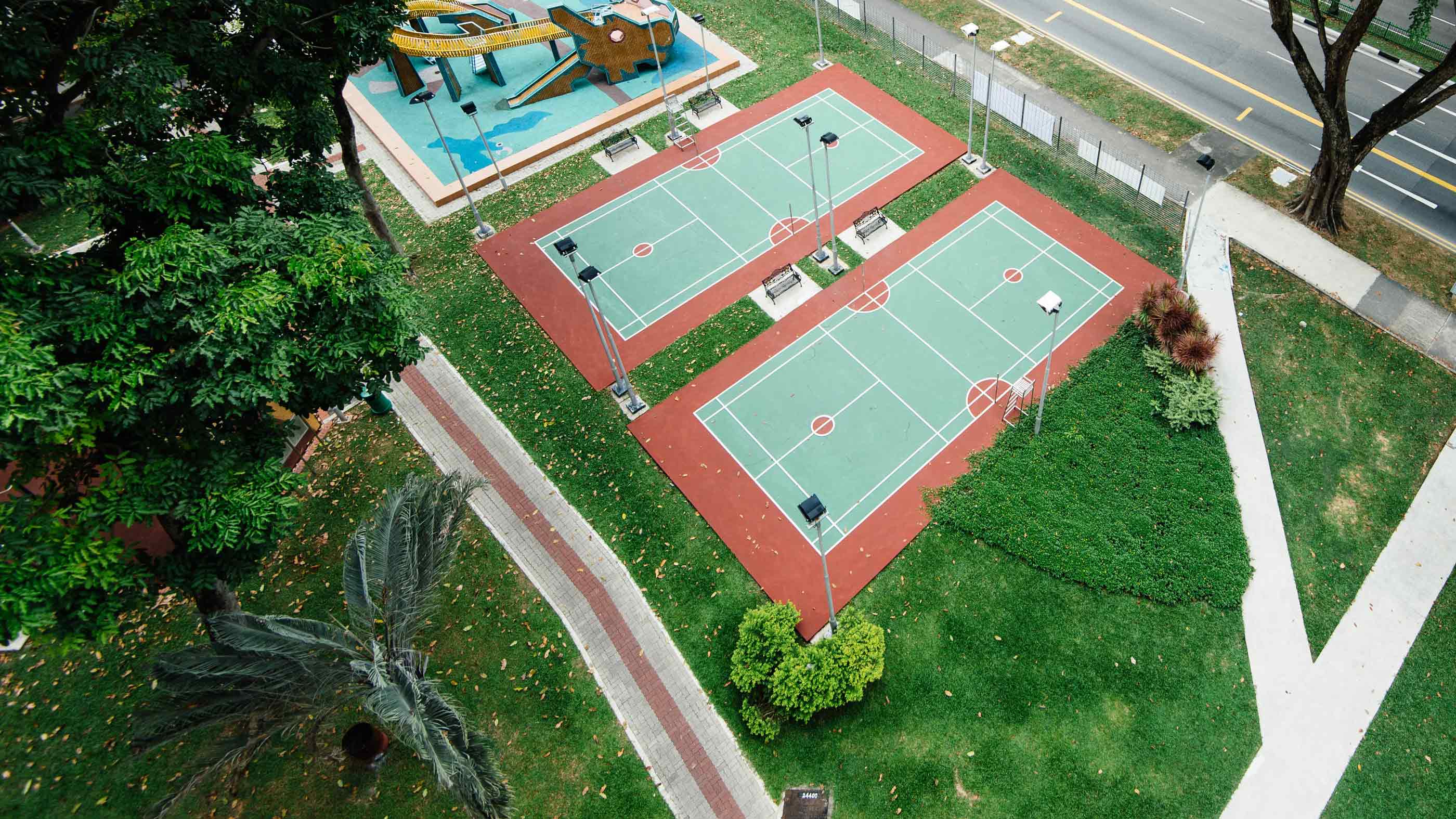 Backyard recreation area with sport-court lighting and outdoor audio