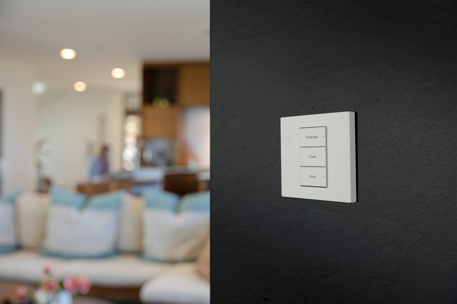 A lighting control wall keypad in a house.
