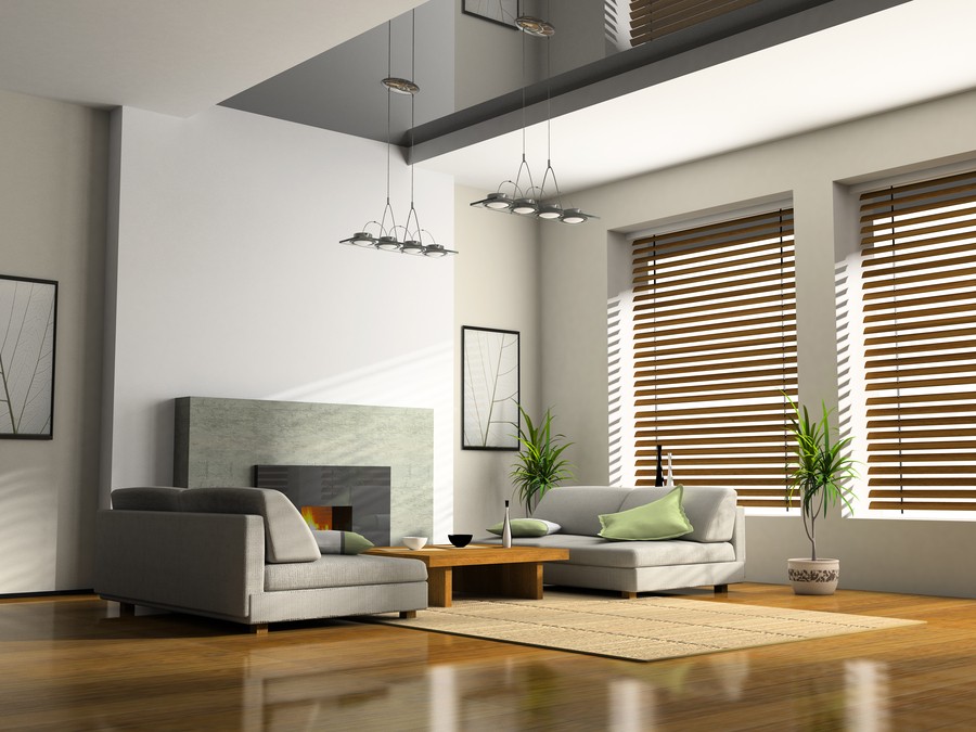 A sleek, contemporary living room with Lutron motorized window blinds.