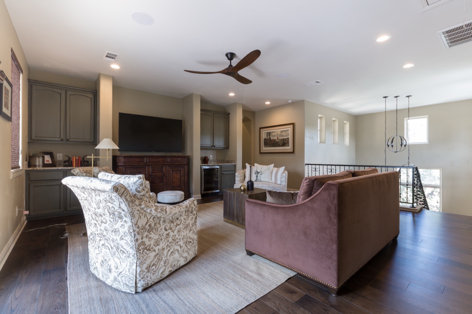 Upstairs den with a wall-mounted TV and media cabinet