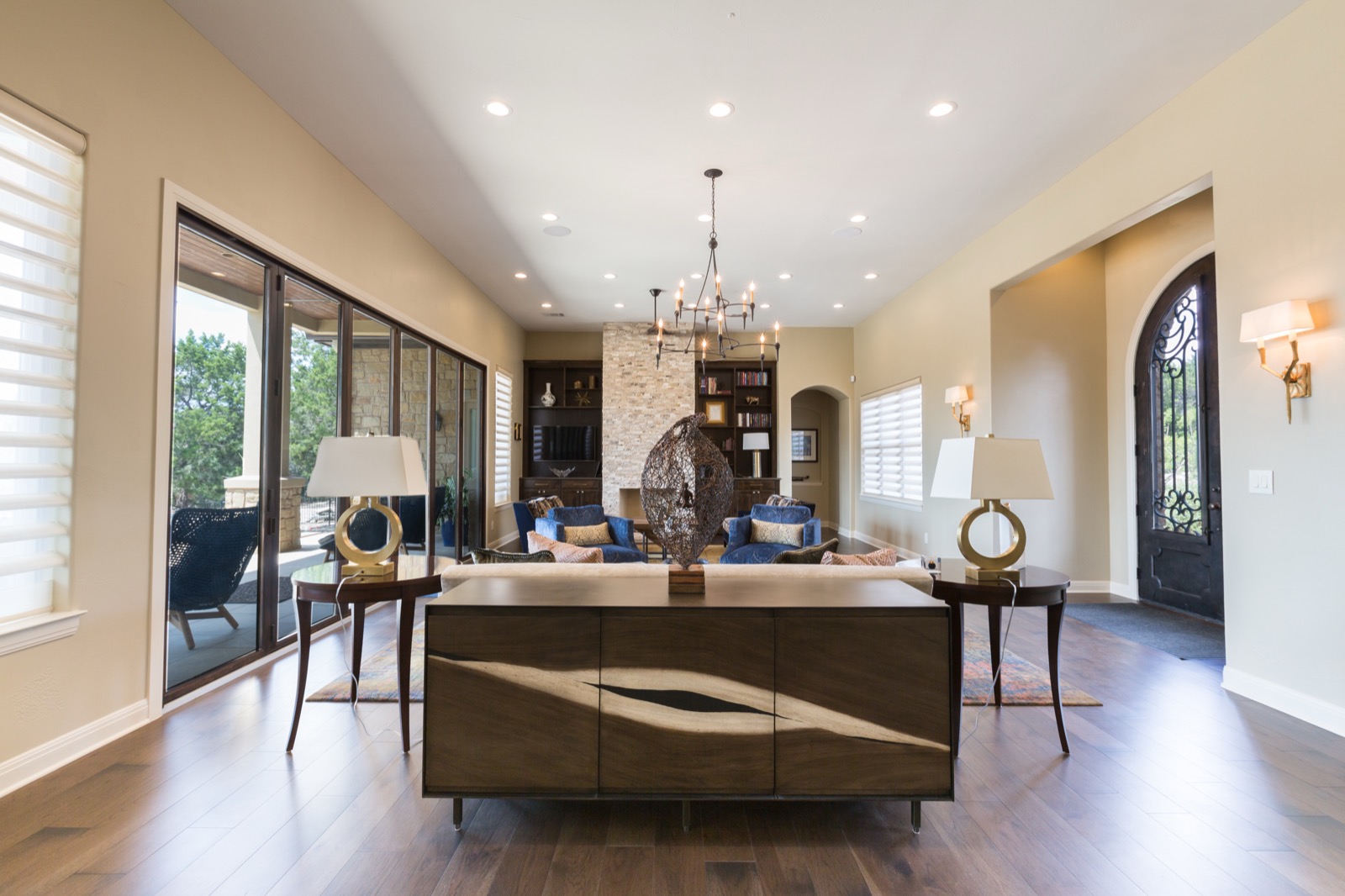 Formal living room under a candle-style chandelier