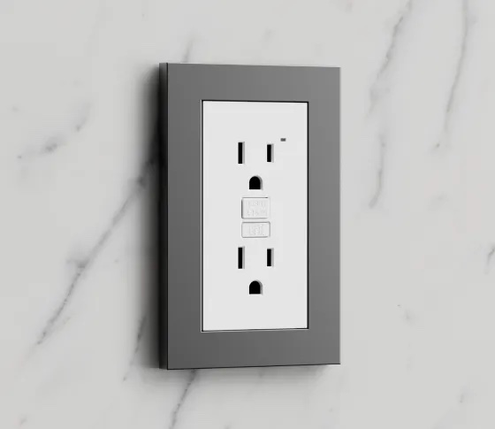 Control4 Lux outlet with a stone grey metal faceplate on a marble backsplash