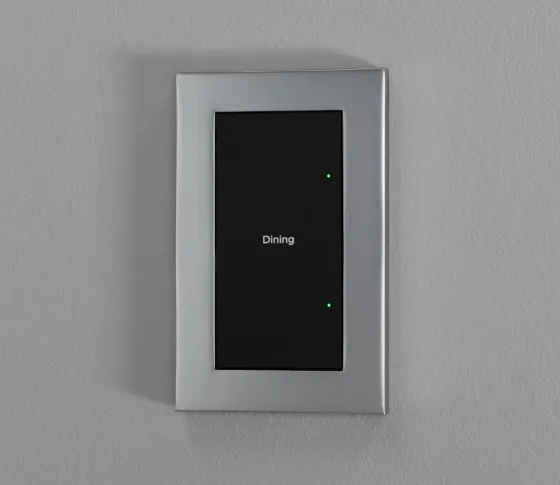 Control4 Lux switch with a black engraved button and satin nickel faceplate