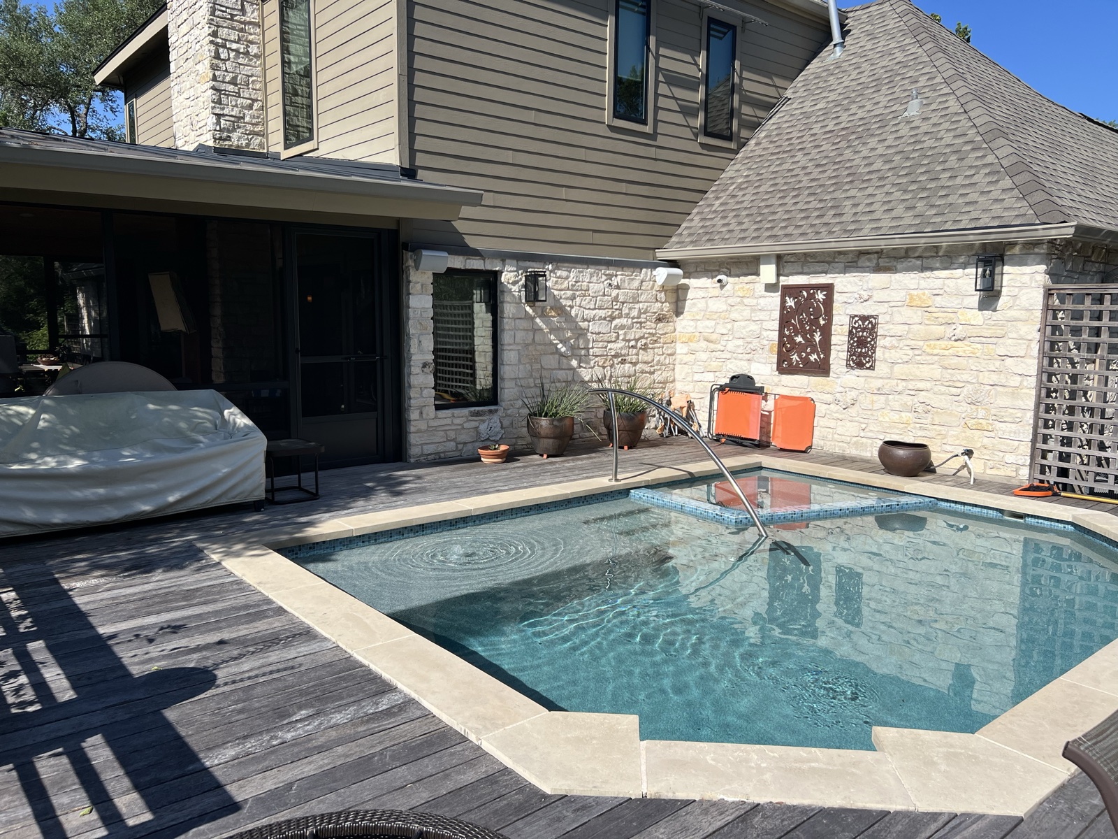 The backyard pool and deck behind the Austin home