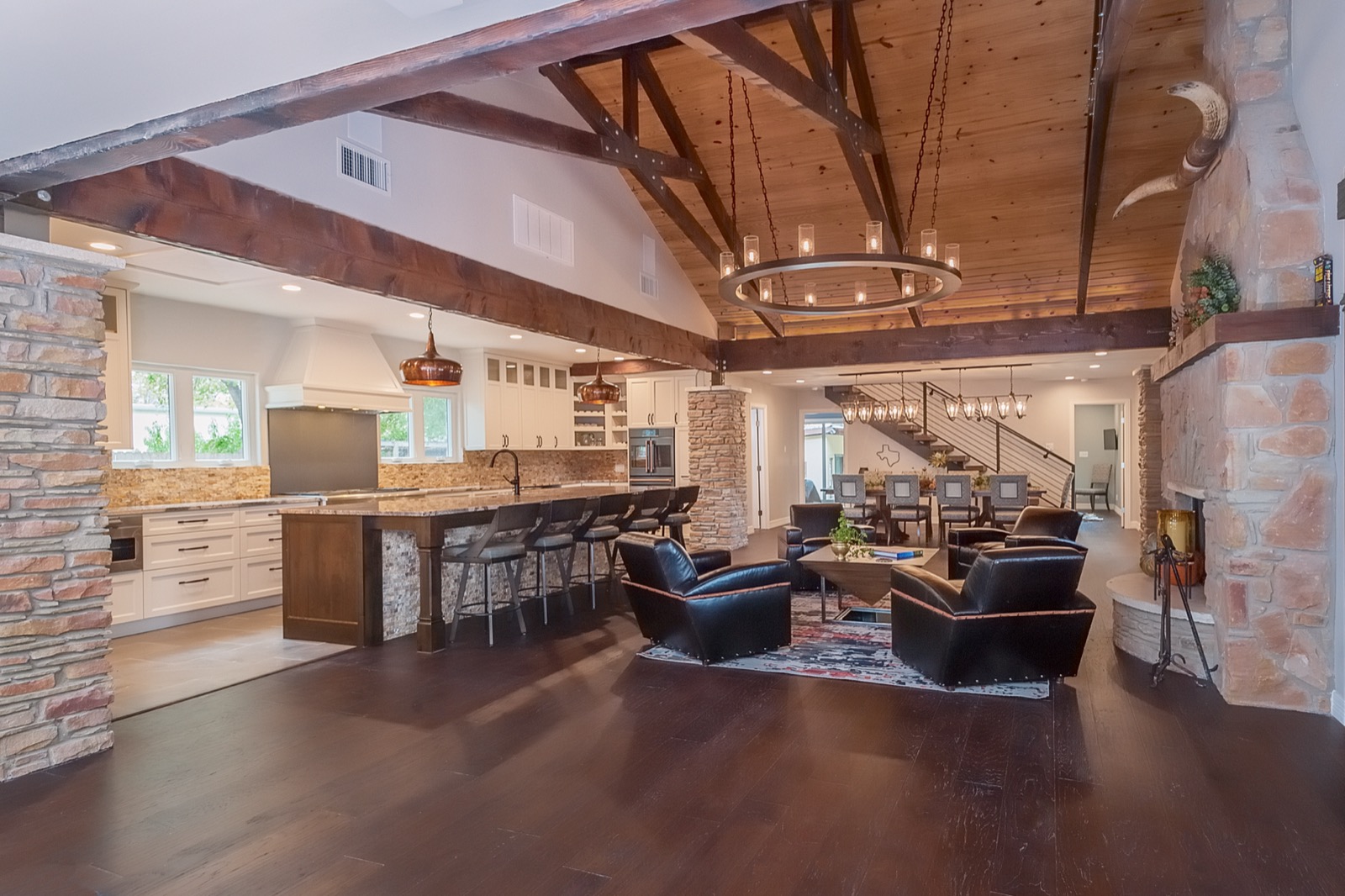 Open kitchen and sitting area under the great room trusses