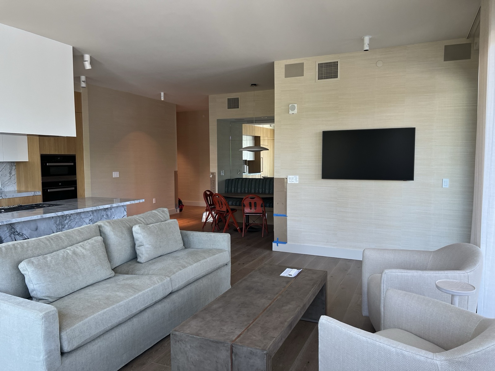 Downtown Austin condo living room with in-ceiling speakers and a wall-mounted TV