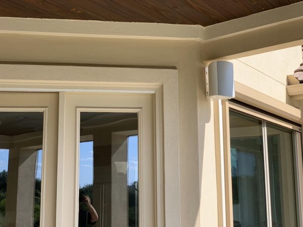 Speaker mounted on patio at home
