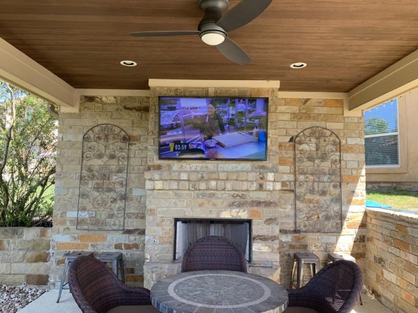 TV mounted on stone wall