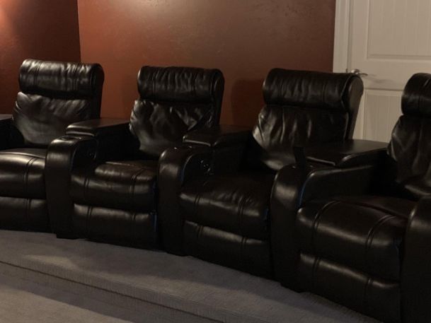 black leather couches in home theater
