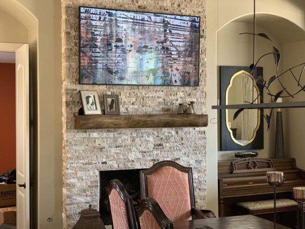 TV mounted on stone wall